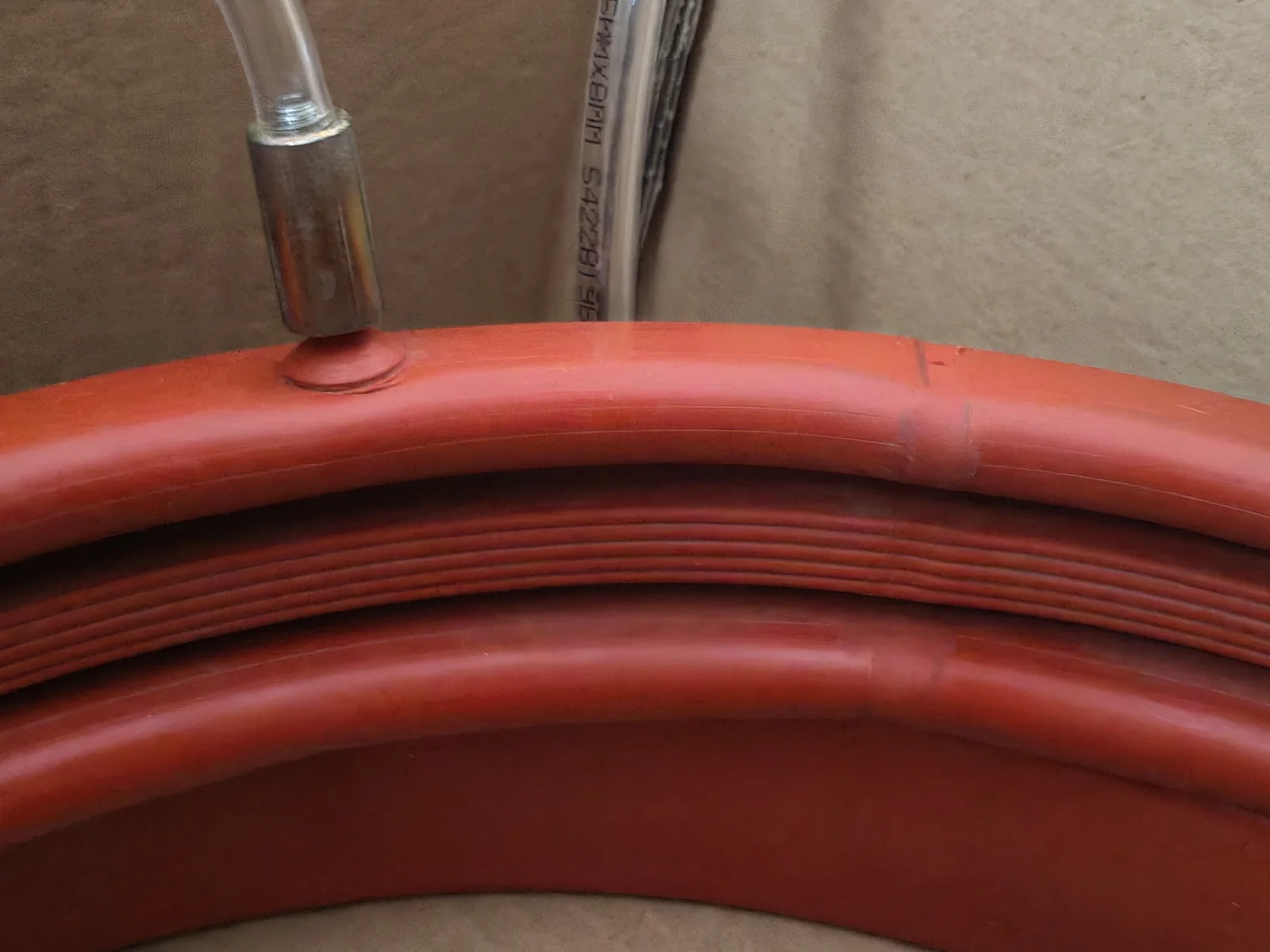 Red custom inflatable seal ring and valve configuration, view 3